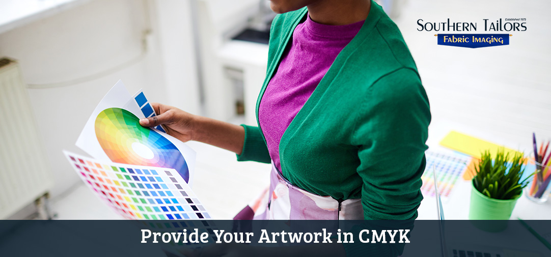 Picture of woman preparing artwork for printing in a service center